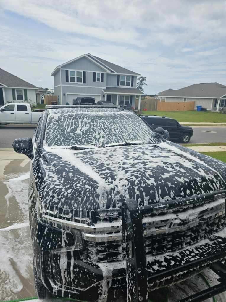 Vehicle covered in cleaning foam